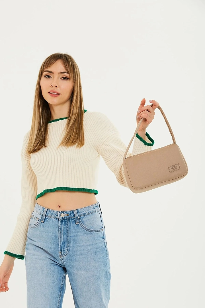 A wholesale clothing model wears mna11053-single-compartment-canvas-fabric-daily-sports-baguette-hand-and-shoulder-bag, Turkish wholesale Bag of Mina Fashion