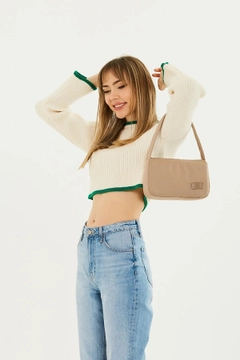 A wholesale clothing model wears mna11053-single-compartment-canvas-fabric-daily-sports-baguette-hand-and-shoulder-bag, Turkish wholesale Bag of Mina Fashion