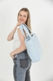 A wholesale clothing model wears mna11091-canvas-shoulder-bag-with-3-compartments-and-2-side-pockets-with-zipper-closure, Turkish wholesale  of 