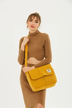 A wholesale clothing model wears mna11114-postman-model-5-compartment-adjustable-strap-daily-unisex-arm-and-shoulder-bag, Turkish wholesale Bag of Mina Fashion