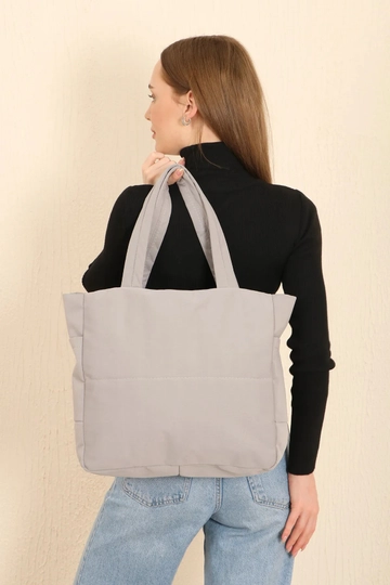 A wholesale clothing model wears  Canvas Shoulder Bag With 3 Compartments And 2 Side Pockets With Zipper Closure
, Turkish wholesale Bag of Mina Fashion