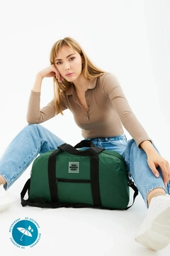 A wholesale clothing model wears mna11262-waterproof-travel-fitness-and-sports-bag-with-front-pocket-detail-and-adjustable-strap, Turkish wholesale Bag of Mina Fashion