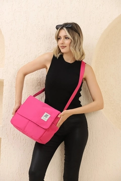 A wholesale clothing model wears mna11282-postman-model-5-compartment-adjustable-strap-daily-unisex-arm-and-shoulder-bag, Turkish wholesale Bag of Mina Fashion