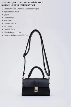 A wholesale clothing model wears mna11384-faux-leather-women's-hand-arm-and-shoulder-bag-with-snap-fastener-and-adjustable-strap, Turkish wholesale Bag of Mina Fashion