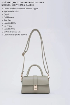 A wholesale clothing model wears mna11385-faux-leather-women's-handbag-and-shoulder-bag-with-adjustable-strap-with-snap-fasteners, Turkish wholesale Bag of Mina Fashion