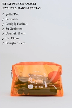 A wholesale clothing model wears mna11567-transparent-pvc-travel-&-makeup-bag, Turkish wholesale Bag of Mina Fashion