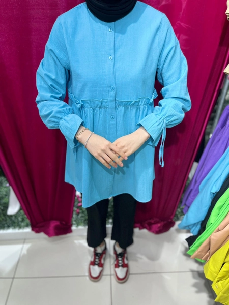 A model wears 47401 - Shirt - Blue, wholesale Shirt of Miena to display at Lonca