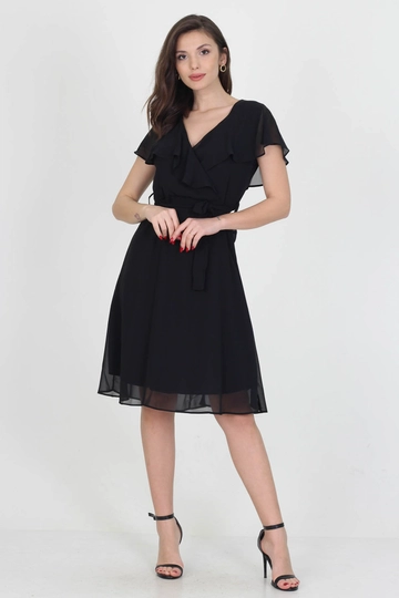 Bir model, Mode Roy toptan giyim markasının  Elbise - Siyah
 toptan Elbise ürününü sergiliyor.