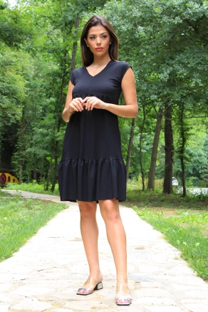A model wears MRO10104 - V-neck Skirt Frilly Summer Dress - Black, wholesale Dress of Mode Roy to display at Lonca
