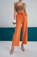 A wholesale clothing model wears myf10222-linen-drawstring-trousers-orange, Turkish wholesale  of 