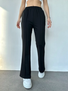 A wholesale clothing model wears myf10479-flared-trousers, Turkish wholesale Sweatpants of My Fashion