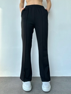 A wholesale clothing model wears myf10479-flared-trousers, Turkish wholesale Sweatpants of My Fashion