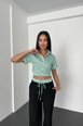 A wholesale clothing model wears new10258-shirt-collar-stripe-pattern-top-wide-leg-elastic-bottom-set-green-&-black, Turkish wholesale  of 