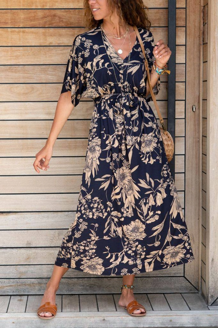A wholesale clothing model wears PBO10283 - Floral Printed Knitted Crepe Fabric  Waist Belted Short Sleeve Dress - Navy Blue, Turkish wholesale Dress of Polo Bonetta