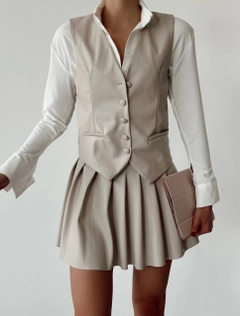 A wholesale clothing model wears qes10011-leather-vest-stone, Turkish wholesale Vest of Qesto Fashion