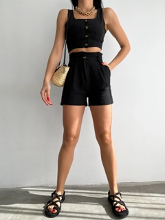 A wholesale clothing model wears 10046-black-linen-vest-and-shorts-set, Turkish wholesale Suit of Radica Fashion