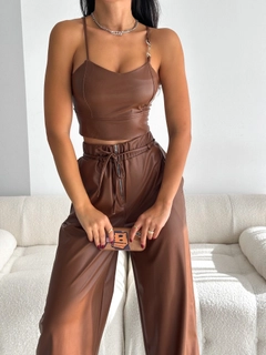 A wholesale clothing model wears raf10021-brown-buckle-detailed-leather-crop, Turkish wholesale Crop Top of Radica Fashion