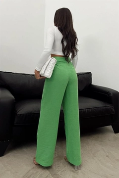 A wholesale clothing model wears REY10828 - Raw Linen Loose Trousers - Green, Turkish wholesale Pants of Reyon