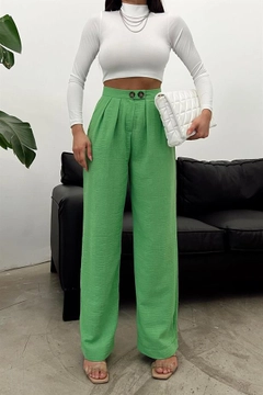 A wholesale clothing model wears REY10828 - Raw Linen Loose Trousers - Green, Turkish wholesale Pants of Reyon