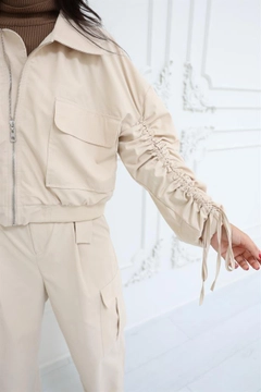 A wholesale clothing model wears rey11090-elastic-waist--gathered-sleeve-bomber-jacket-stone, Turkish wholesale Jacket of Reyon
