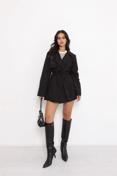 A wholesale clothing model wears rey11504-belted-button-detail-trench-coat-black, Turkish wholesale Trenchcoat of Reyon