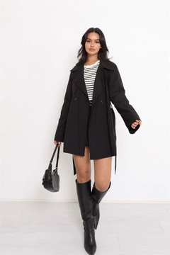 A wholesale clothing model wears rey11504-belted-button-detail-trench-coat-black, Turkish wholesale Trenchcoat of Reyon