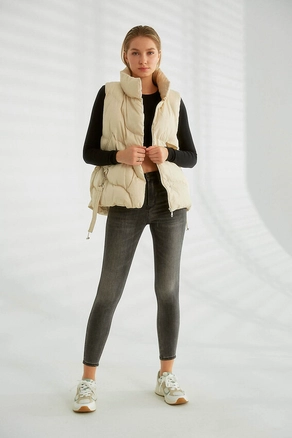 A model wears 28411 - Vest - Stone, wholesale undefined of Robin to display at Lonca