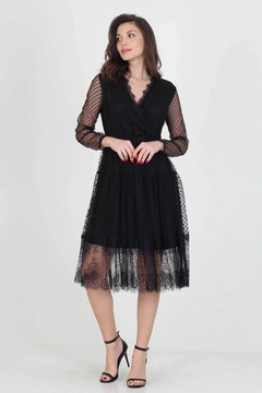 Bir model, Mode Roy toptan giyim markasının 34989 - Dress - Black toptan Elbise ürününü sergiliyor.