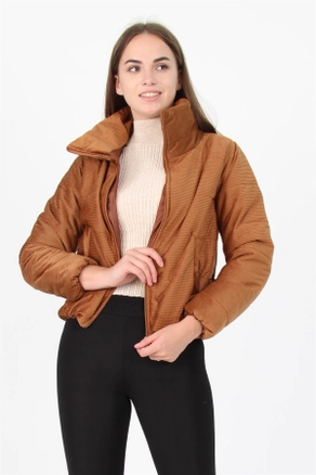 A model wears 35024 - Coat - Tan, wholesale undefined of Roy Moda to display at Lonca