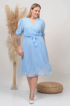 A model wears 35031 - Dress - Baby Blue, wholesale undefined of Mode Roy to display at Lonca