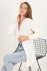 A model wears 35044 - Cardigan - White, wholesale undefined of Mode Roy to display at Lonca