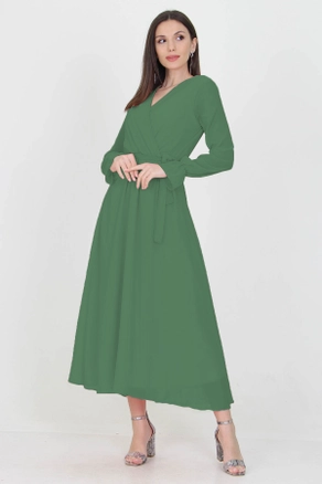 A model wears 35138 - Dress - Green, wholesale Dress of Mode Roy to display at Lonca