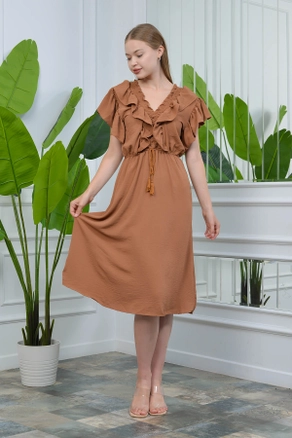A model wears 35198 - Dress - Tan, wholesale Dress of Roy Moda to display at Lonca