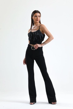 A wholesale clothing model wears sns10869-black-flared-belted-knitted-fabric-trousers-pnt32439, Turkish wholesale Pants of SENSE