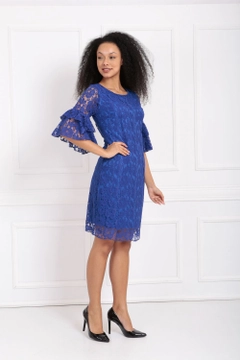 A wholesale clothing model wears sns10999-sense-saks-guipure-sleeves-flounce-dress, Turkish wholesale Dress of SENSE
