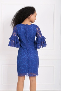 A wholesale clothing model wears sns10999-sense-saks-guipure-sleeves-flounce-dress, Turkish wholesale Dress of SENSE