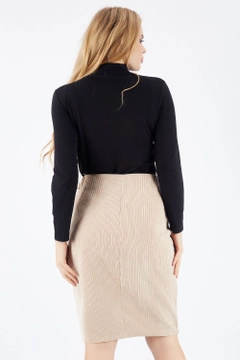 A wholesale clothing model wears sns10049-beige-hidden-zipper-long-velvet-skirt, Turkish wholesale Skirt of SENSE