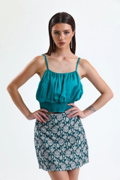 A wholesale clothing model wears sns10006-petrol-jacquard-mini-skirt_etk32609, Turkish wholesale Skirt of SENSE
