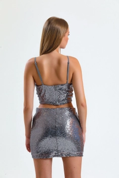 A wholesale clothing model wears sns10254-silver-separated-zippered-sequin-bustiyer_bus32289, Turkish wholesale Bustier of SENSE