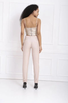 A wholesale clothing model wears sns10255-beige-waist-belted-ornamental-stitched-trousers, Turkish wholesale Pants of SENSE