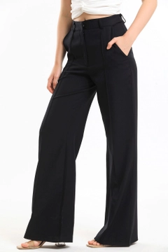 A wholesale clothing model wears sns10202-black-ornamental-stitched-hürrem-fabric-wide-leg-trousers, Turkish wholesale Pants of SENSE