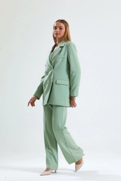 A wholesale clothing model wears sns10576-sense-mold-green-women's-suit-jacket-and-trousers, Turkish wholesale Dress of SENSE