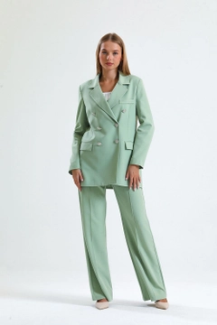 A wholesale clothing model wears sns10576-sense-mold-green-women's-suit-jacket-and-trousers, Turkish wholesale Dress of SENSE