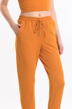 A wholesale clothing model wears sns10640-sense-saffron-pocket-scuba-crepe-trousers-pnt33884, Turkish wholesale Pants of SENSE