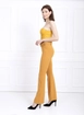A wholesale clothing model wears sns10628-sense-mustard-flare-leg-belted-knitted-fabric-trousers-pnt32439, Turkish wholesale  of 
