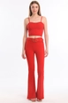 A wholesale clothing model wears sns10750-sense-red-flare-leg-belted-knitted-fabric-trousers-pnt32439, Turkish wholesale  of 