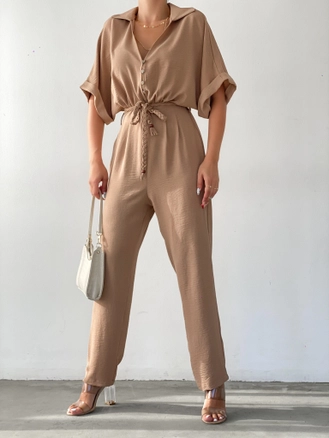 A model wears 35320 - Jumpsuit - Mink, wholesale undefined of Sobe to display at Lonca