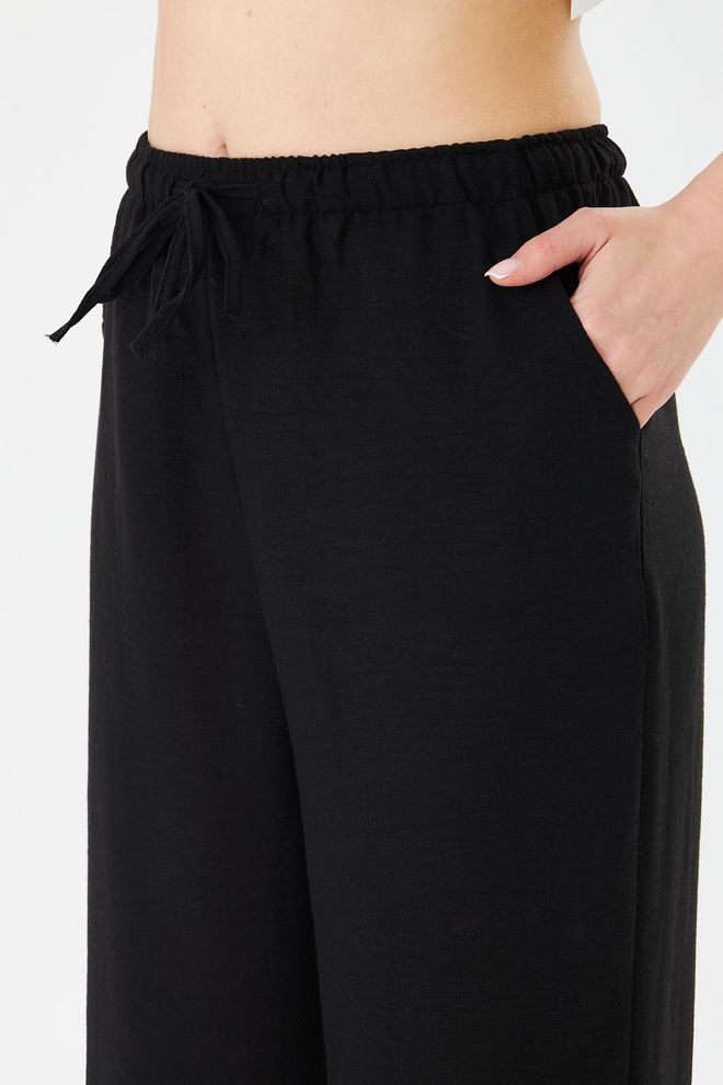 Sortie Collection Black Tapered Carrot Pants With Drawstring Closure Wholesale Clothing 1