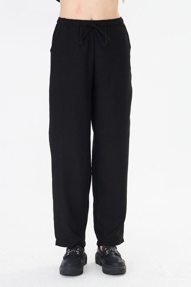 Sortie Collection Black Tapered Carrot Pants With Drawstring Closure Wholesale Clothing Elegant