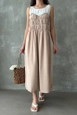 Bir model,  toptan giyim markasının top10788-stone-strap-dress toptan  ürününü sergiliyor.